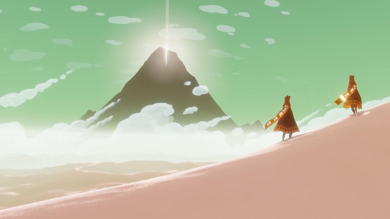 Still from Journey game of two characters walking up a sand dune with a mountain in the background.